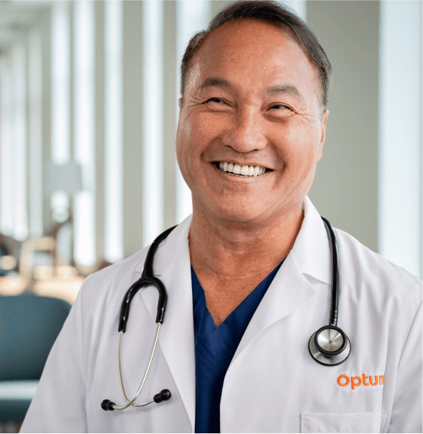 A healthcare professional smiling at Optum Oregon