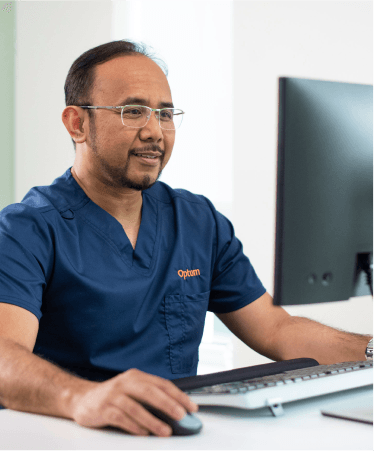 Doctor checking his computer